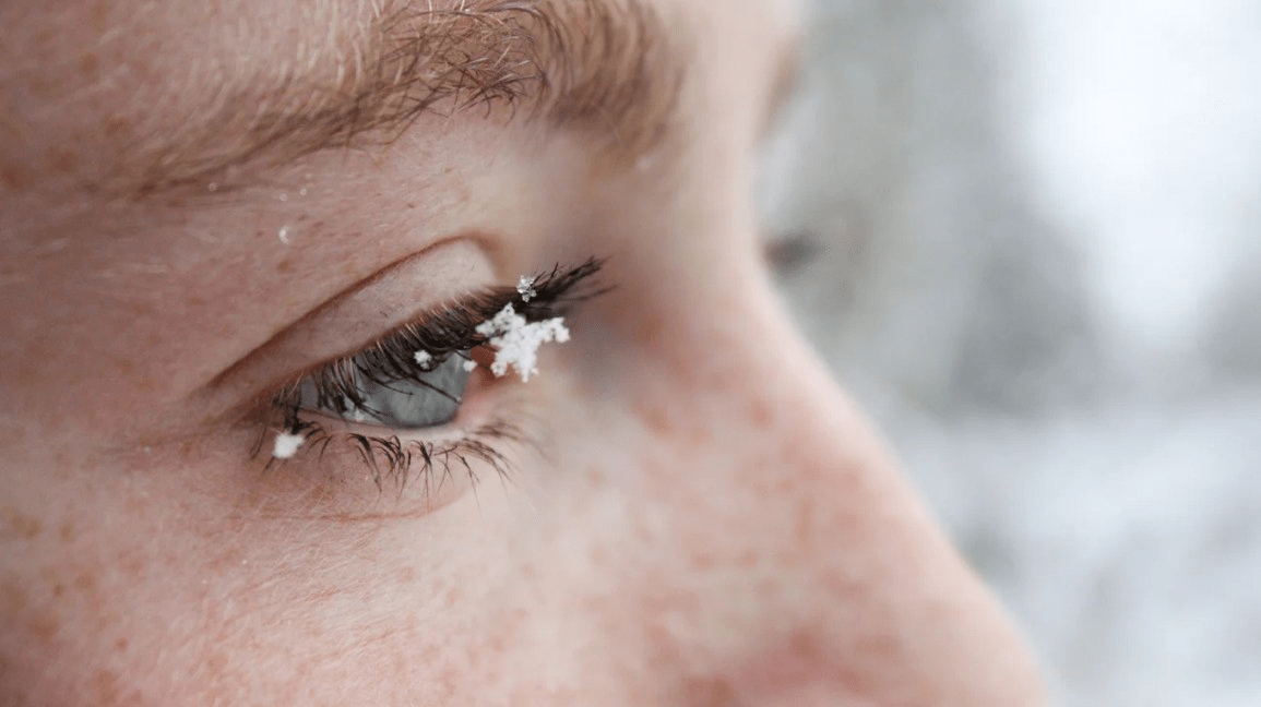 Close-up of snowflakes on eyelashes