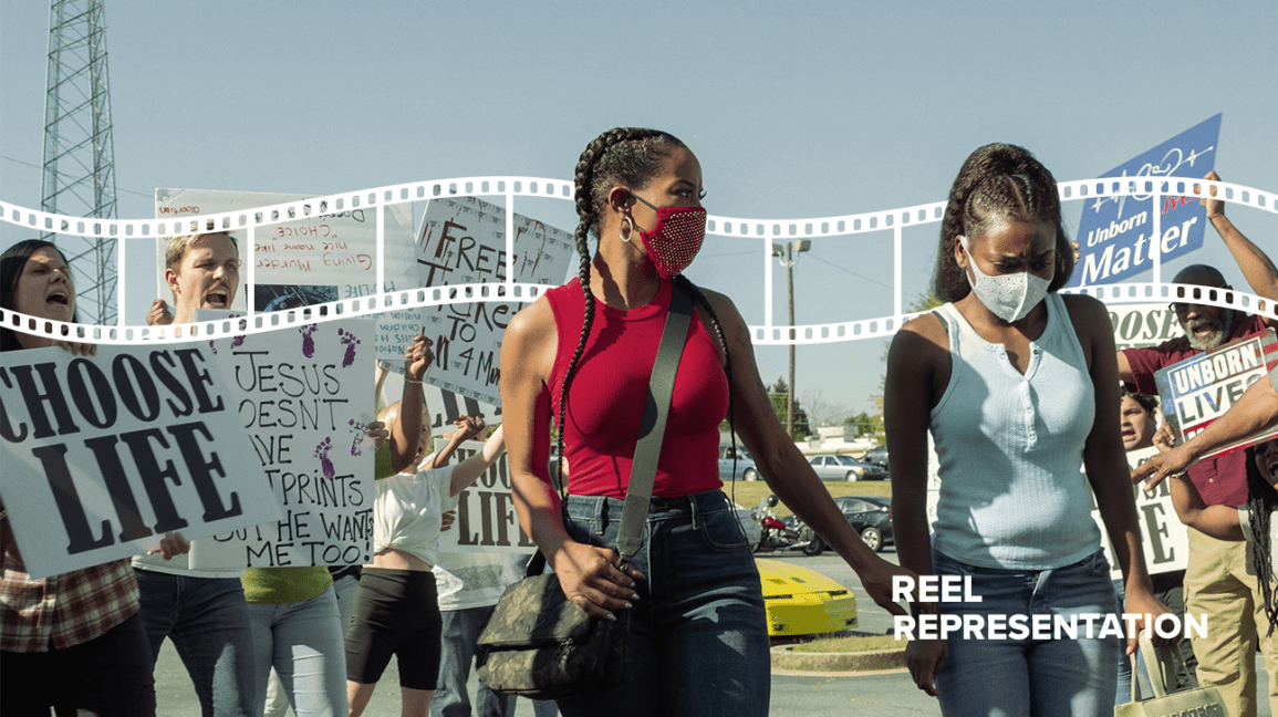 Mercedes and Terricka walking to clinic amid protestors