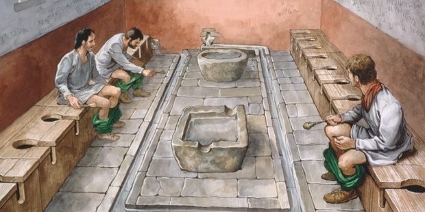 Roman public toilets featured long benches with holes