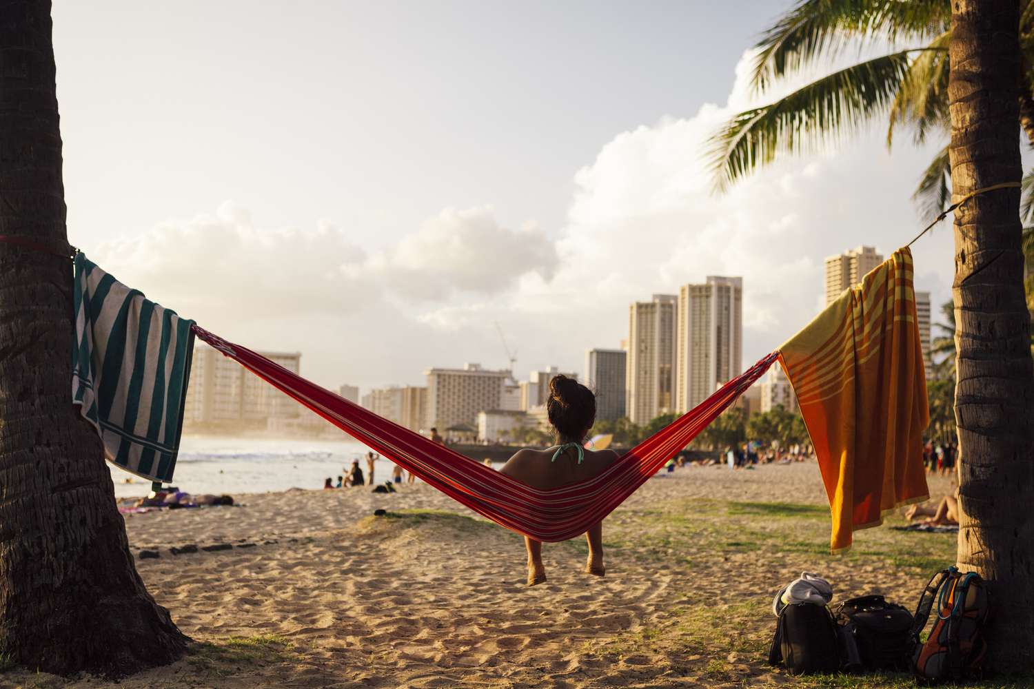 Relaxing on Waikiki Beach at sunset