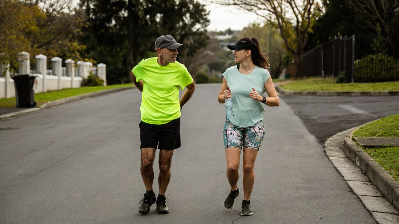 elderly individual walking with back pain relief