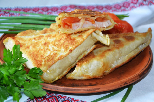 Delicious Lavash Triangles Filled with Cheese and Sausage