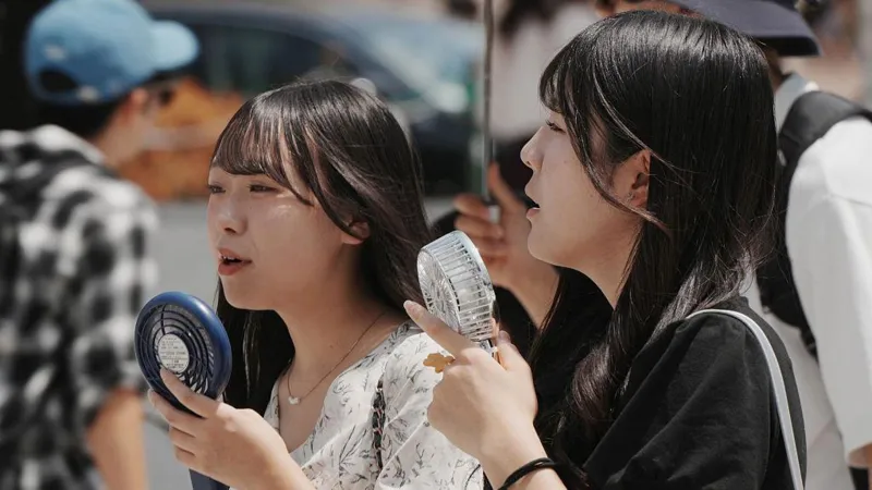 Asia swelters under record heatwaves as floods ravage the region