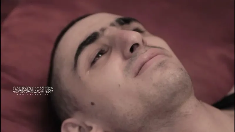 Rom Braslavski lying on the ground, crying