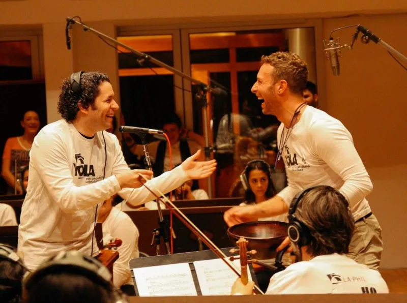 Los Angeles Philharmonic Association Gustavo Dudamel and Chris Martin share a joke during rehearsals for the 2016 Super Bowl half-time show