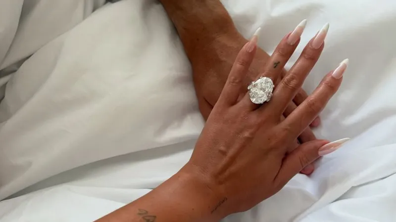 Georgina Rodríguez via Instagram Two hands are pictured on top on one another, The top hand has fingers splayed with a long french manicure, and an enormous diamond-style ring on the fourth finger.