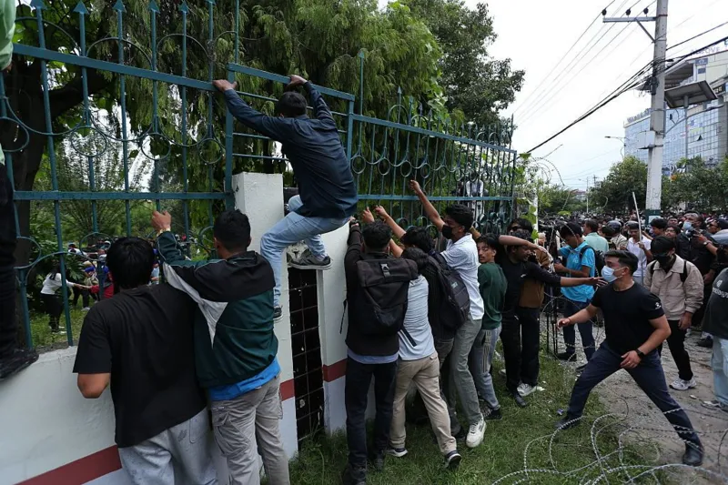 Getty Images Protesters clash with police outside the Parliament in Kathmandu
