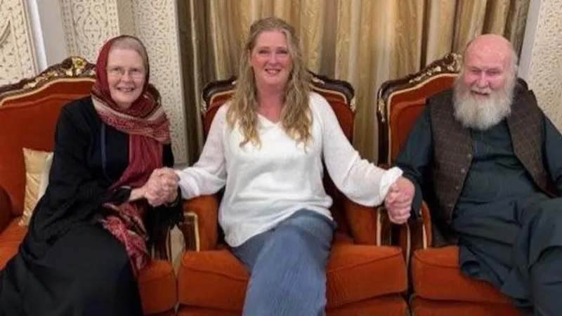 Family handout Freed British couple peter and barbie Reynolds sit with their daughter sarah. On the left, Barbie is wearing a dark dress. A blond haired Sarah is sat in the middle of the two, wearing blue jeans and a white top. On the right sits Peter, he's wearing a traditional Afghan dark top and trousers, with a brown textured waistcoat. All are smiling at the camera.
