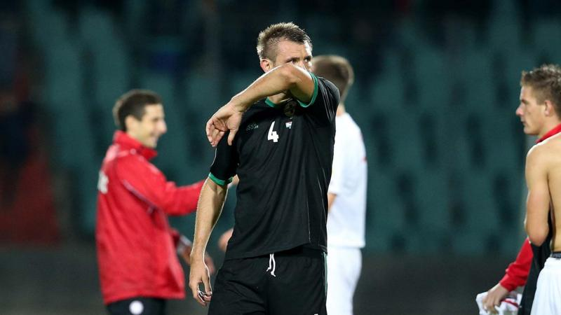 Gareth McAuley looks dejected after Northern Ireland's 3-2 defeat by Luxembourg in 2013