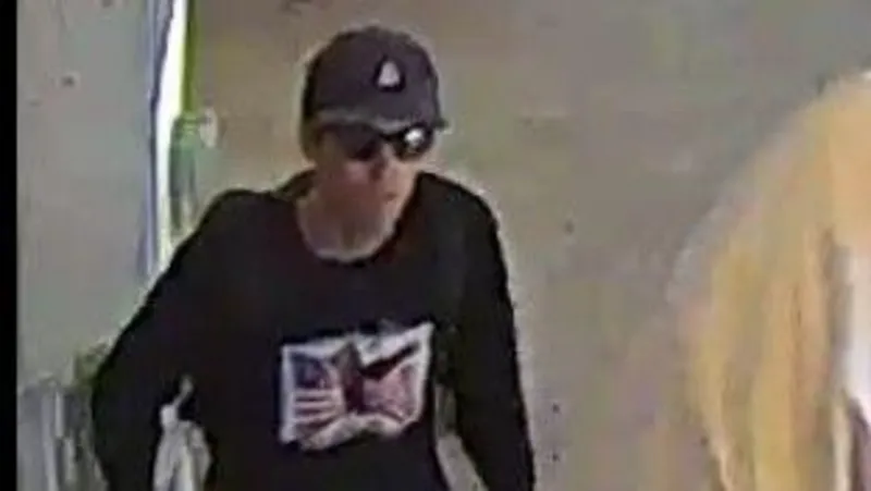 FBI Man in dark clothing and sunglasses