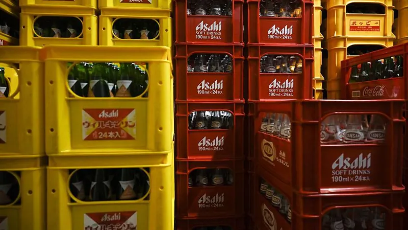 Getty Images Bottles of Asahi carbonated water in red and yellow crates stored at a liquor store in Tokyo