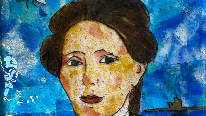 Debra Tracey A painting of a woman with a striking face. She has short, brown hair and she is in front of the Tower of Refuge. The background of the painting is blue.