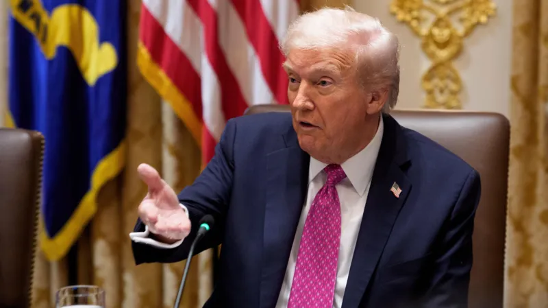 EPA A white-haired man in blue jacket, white shirt and pink tie speaks and gestures in an ornate office.