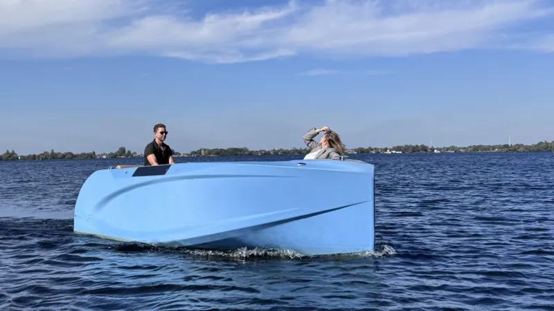 Raw Idea boat on a lake with a man and a woman