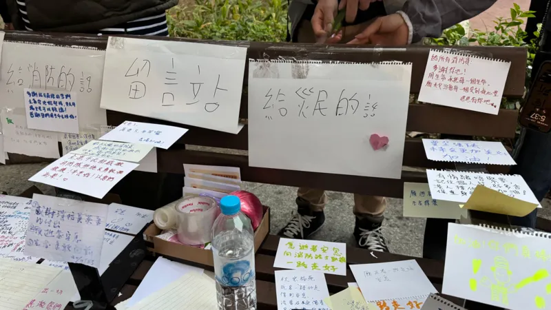 Tributes at the scene with handwritten notes