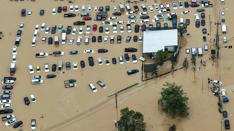 Reuters A drone view shows cars parked in a flooded area in Hat Yai