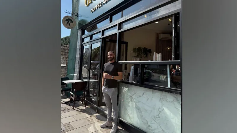 INLIBER/Rusty Nart Rusty Nart leans against the entrance to his coffee 