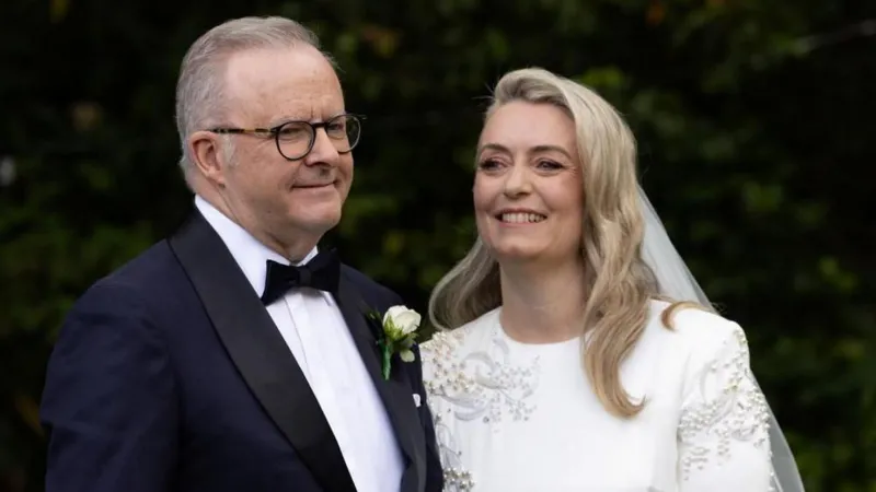 Reuters A headshot photo of Anthony Albanese and Jodie Haydon in their wedding attire