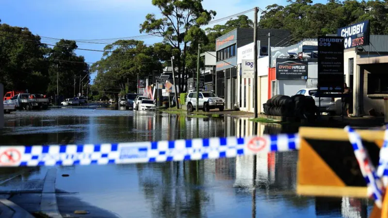AFP via Getty Images A flooded road is seen in the Sydney suburb of North Narrabeen on April 6, 2024, after heavy rain hit New South Wales state.