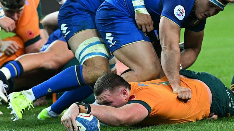 Angus Bell dives over to score a try