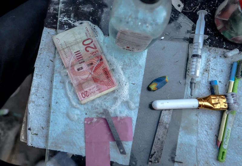 Anadolu via Getty Images Palestinians repair old and worn-out banknotes as the enclave runs out of hard currency on June 02, 2025, in Gaza City