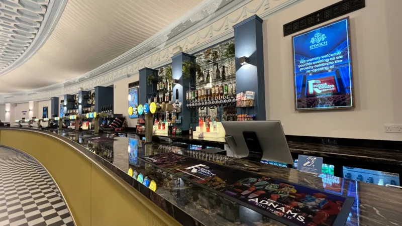 A long bar with beer pumps and Art Deco styling