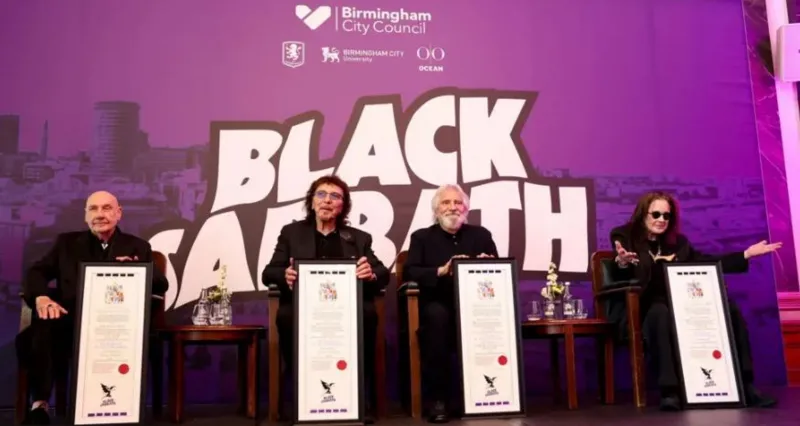 The Black Sabbath band members receiving their city honours; Ozzy Osbourne with arms outstretched