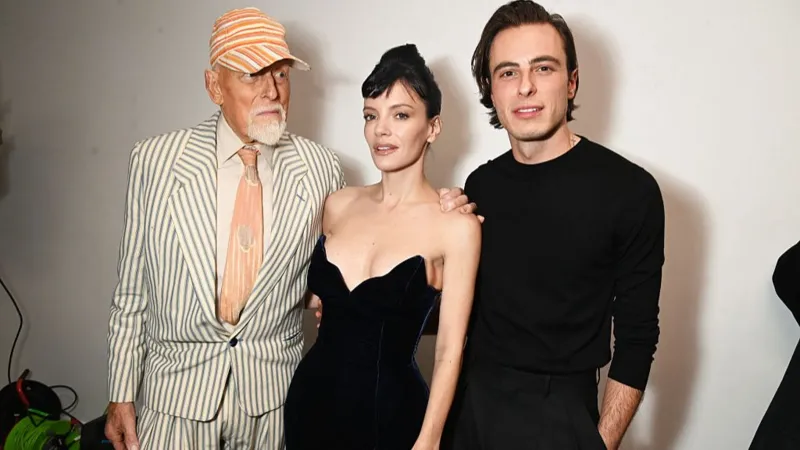 Getty Images Antony Price, Lily Allen and Marco Capaldo pose backstage at the 16Arlington x Antony Price Salon Show on 17 November 2025 in London, England.