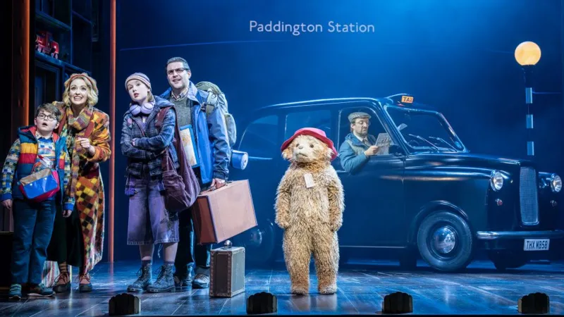 Johan Persson Paddington on stage with the Brown family, with a London black cab in the background
