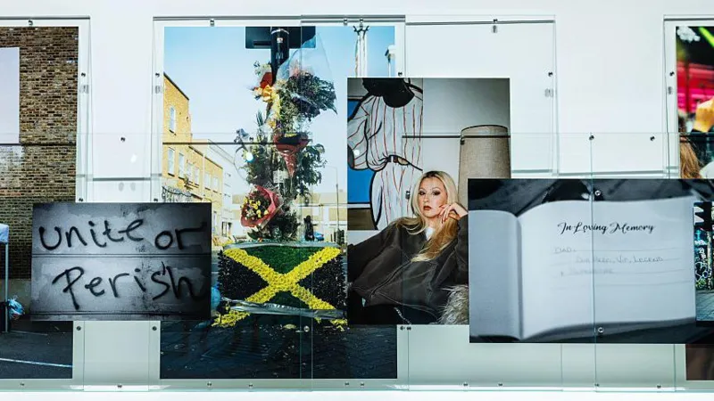 Getty Images A series of Rene Matic's photographs on the gallery wall including a young woman, a floral tribute with a Jamaican flag, graffiti reading