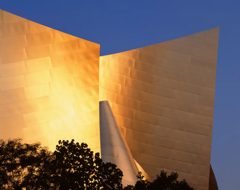 View Pictures Universal Images Group via Getty Images The golden hour view of the Walt Disney Concert Hall in Los Angeles with its titanium cladding shaped like wings.